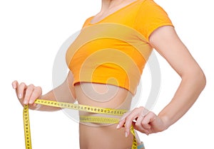 Young woman with centimeter tape