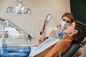 Young woman is in the chair. In the stomatological cabinet