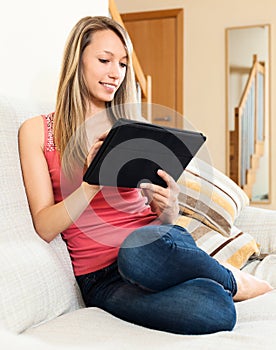 Young woman chating at tablet