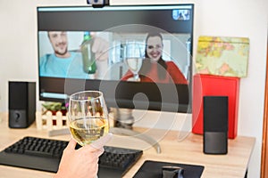 Young woman chatting and drinking wine on computer meeting room with friends - Alternative party during stay sahe at home and