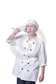 Young woman chef is making a traste food gesture photo