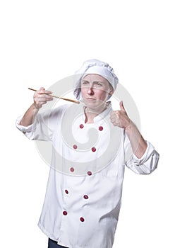 Young woman chef is making a traste food gesture photo