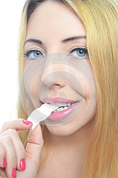 Young woman chewing gum