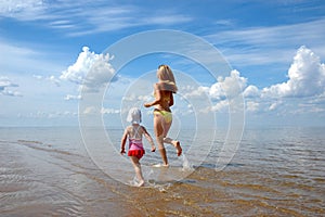 The young woman with the child runing on water