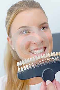 Young woman choosing dentures