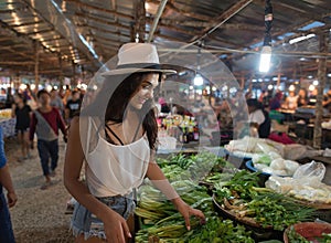 Young Woman Choosing Green Potherbs On Market Girl Shopping On Street Bazaar