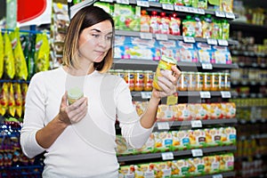 Woman choosing healthy baby food