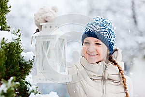 Young woman with Christmas lantern