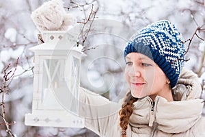 Young woman with Christmas lantern