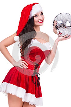 young woman in Christmas wear and hat holding disco ball. isolated on white background.
