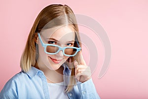 Young woman in cinema glasses for watching 3d movie in cinema. Smiling teenager girl portrait movie viewer in glasses isolated