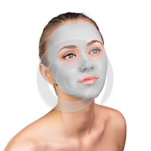 Young woman with clay face mask