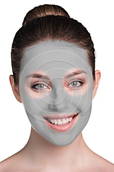 Young woman with clay face mask