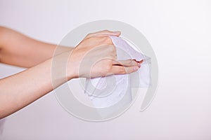 Two hands cleaning with wet wipes photo
