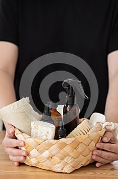 Young woman cleans the kitchen with eco products.