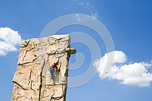 Young woman climb wall