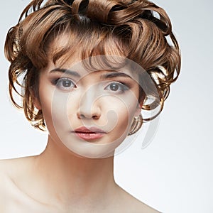 Young woman close up face beauty portrait on white background.