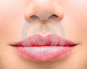 Young woman close up. plump lips