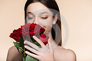 young woman with closed eyes smelling