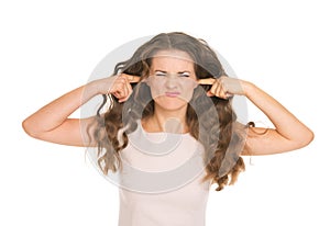 Young woman closing ears