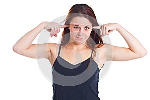 Young woman closing ears with fingers