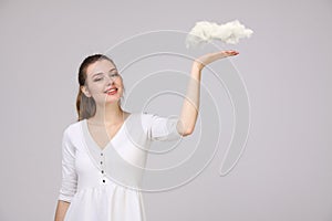 Young woman and cloud, weather forecast concept.