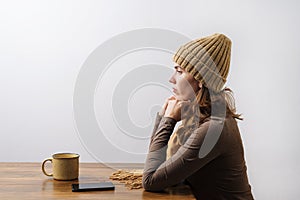 Young woman with coffee and smartphone