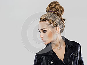 Young woman in Coho jacket.braids hairdo
