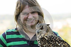 Young woman with collared Scops Owl