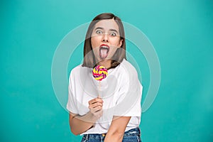 The young woman with colorful lollipop