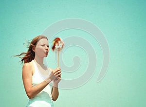 Young woman with a colorful pinwheel