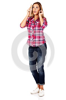 Young woman combing hair hairbrush