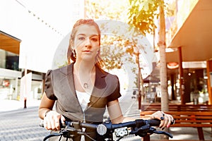 Young woman commuting on bicycle