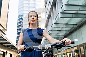 Young woman commuting on bicycle