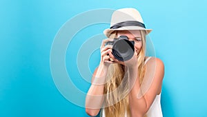 Young woman comparing professional camera