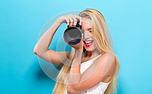 Young woman comparing professional camera