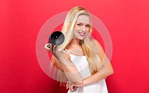 Young woman comparing professional camera