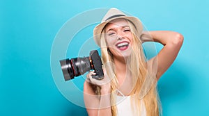 Young woman comparing professional camera