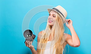 Young woman comparing professional camera