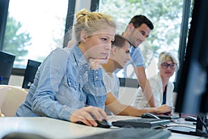 Young woman during computer classes