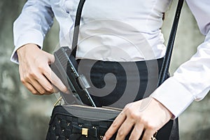 Young woman with concealed weapon