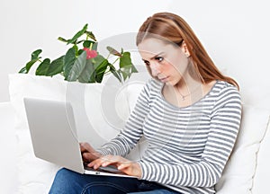 Young woman with concentration on a computer