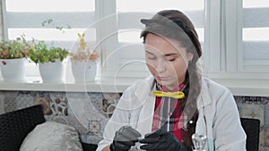 Young woman conducting chemical experiments at home.