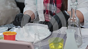 Young woman conducting chemical experiments at home and streaming live on the internet.