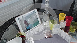 Young woman conducting chemical experiments at home and streaming live on the internet.