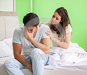 Young woman consoling disappointed impotent husband