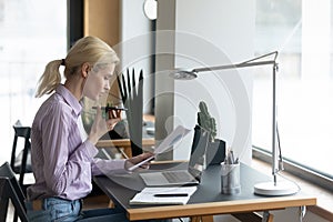 Young woman consult client on smartphone loudspeaker