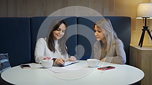 Young woman consulting with insurance agent