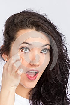 Young woman with contact lense