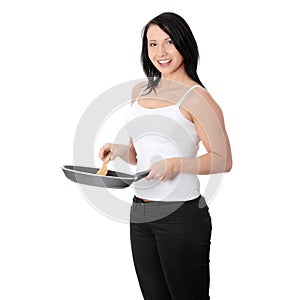 Young woman cooking healthy food